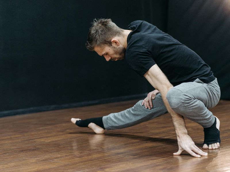 Man performing a plank variation for core control