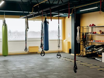 Minimalist gym equipment on a dark floor